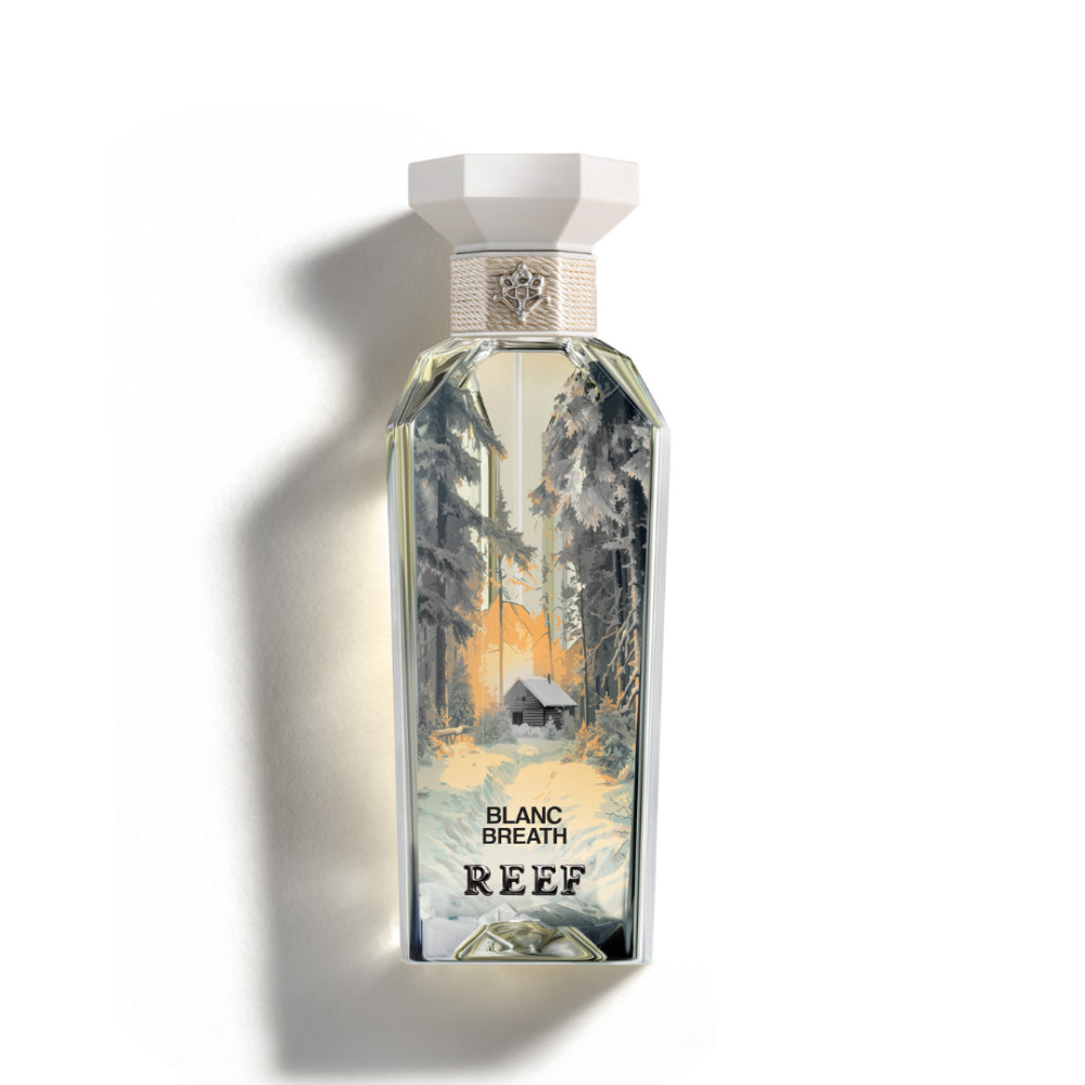 Perfume bottle labeled 'Blanc Breath Reef' with scenic design on a white background
